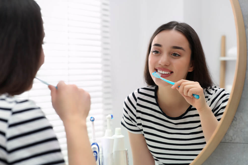 How do you brush teeth with baking soda?