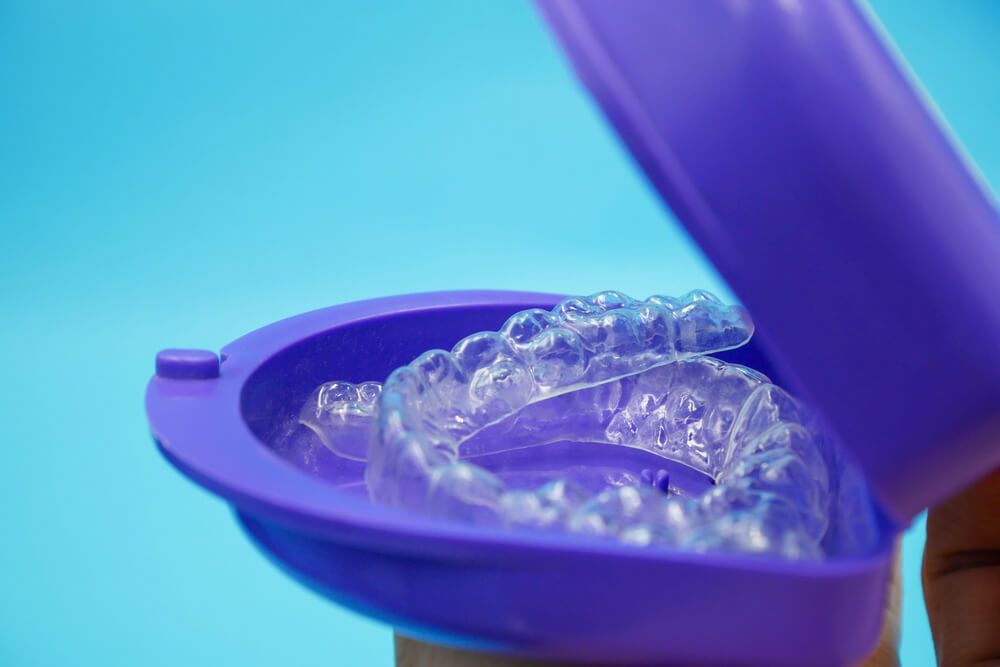 How can retainers help when teeth move?